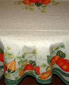large round plastic coated tablecloth with pumpkins
