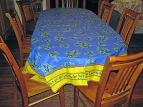 Blue tablecloth with yellow border acrylic coated for table protection and stain resistance