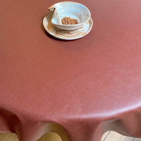 coated linen wipe over tablecloth sienna red