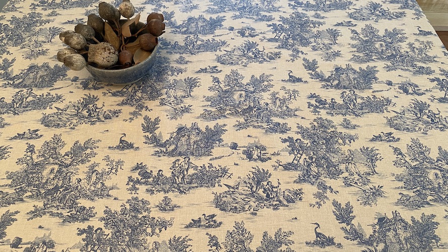 blue and white toile coated tablecloth